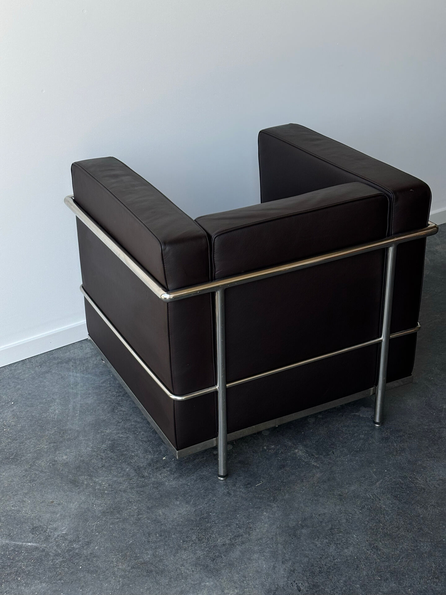 Pair of modernist brown leather armchairs