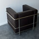 Pair of modernist brown leather armchairs