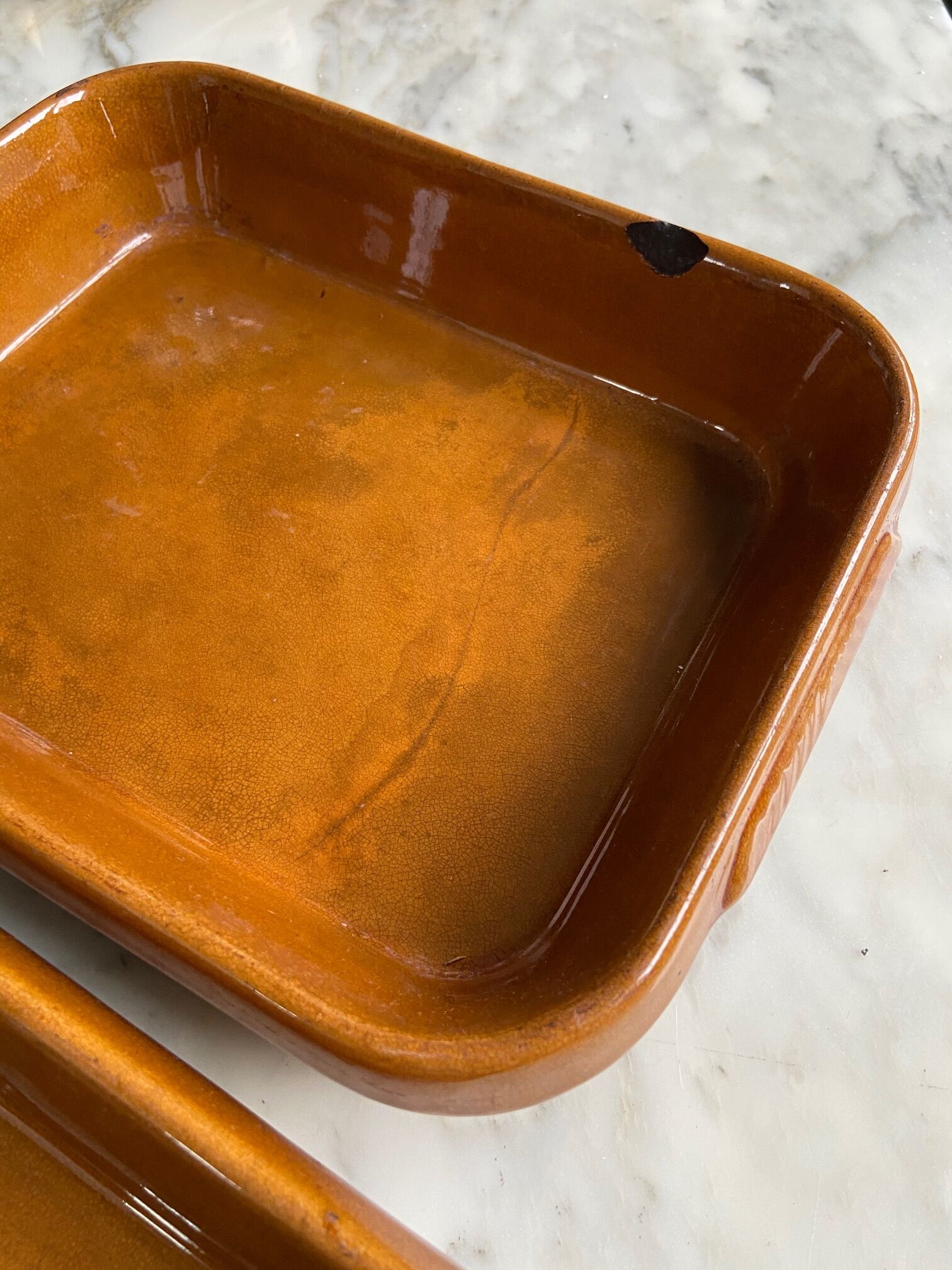 Pair of rectangular enamelled sandstone dishes