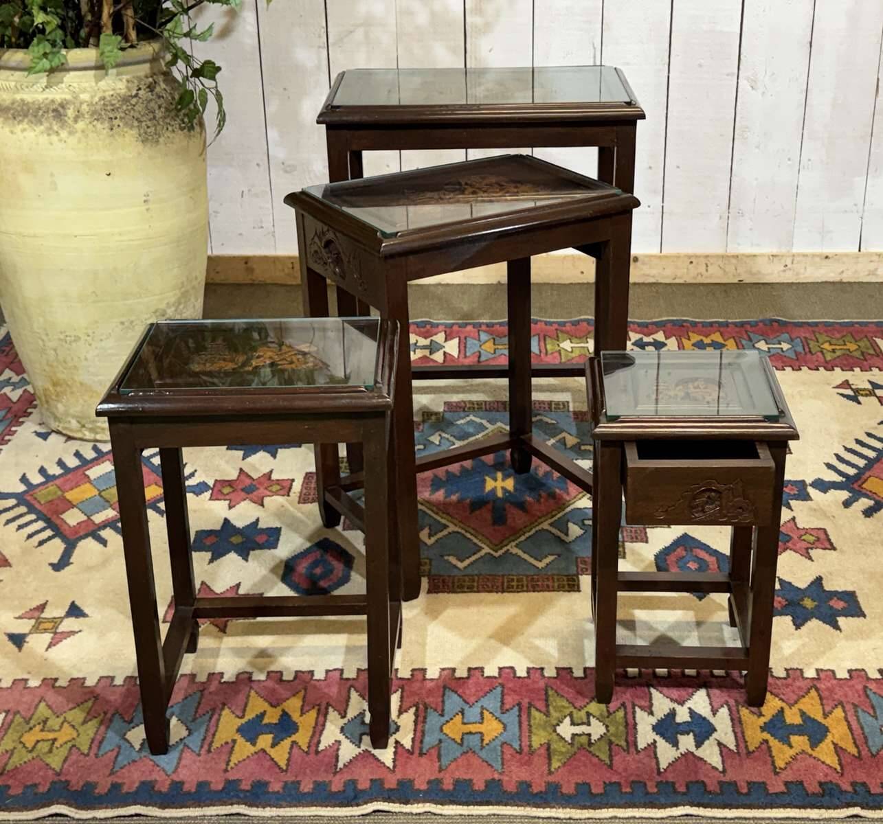 Set of 4 Chinese nesting tables in teak from the 1980s.