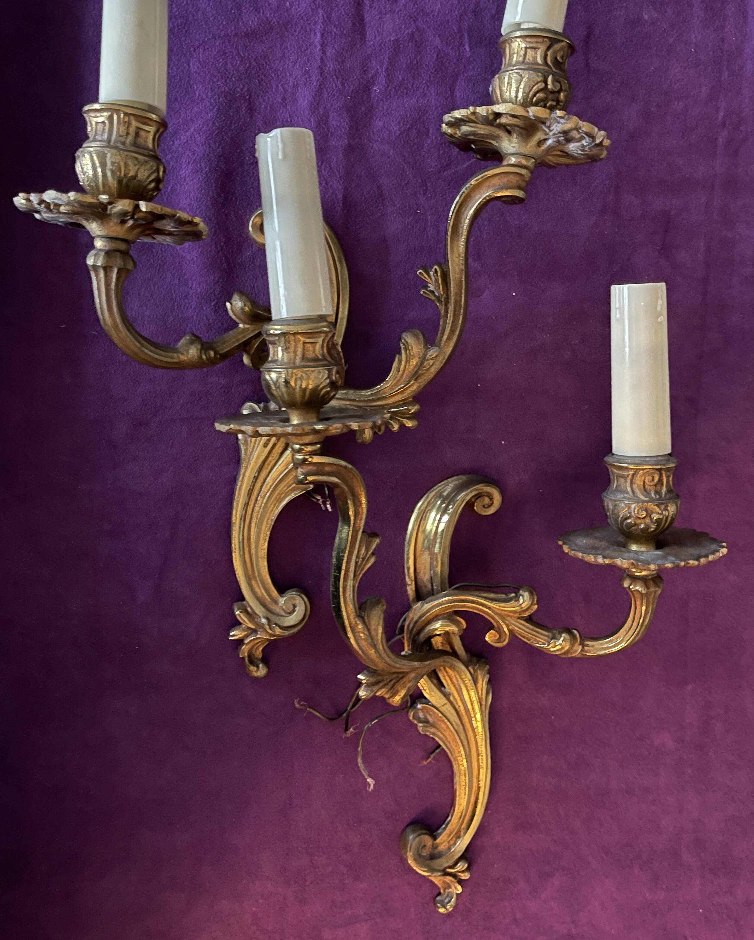 Pair of gilded bronze wall lights, 1950