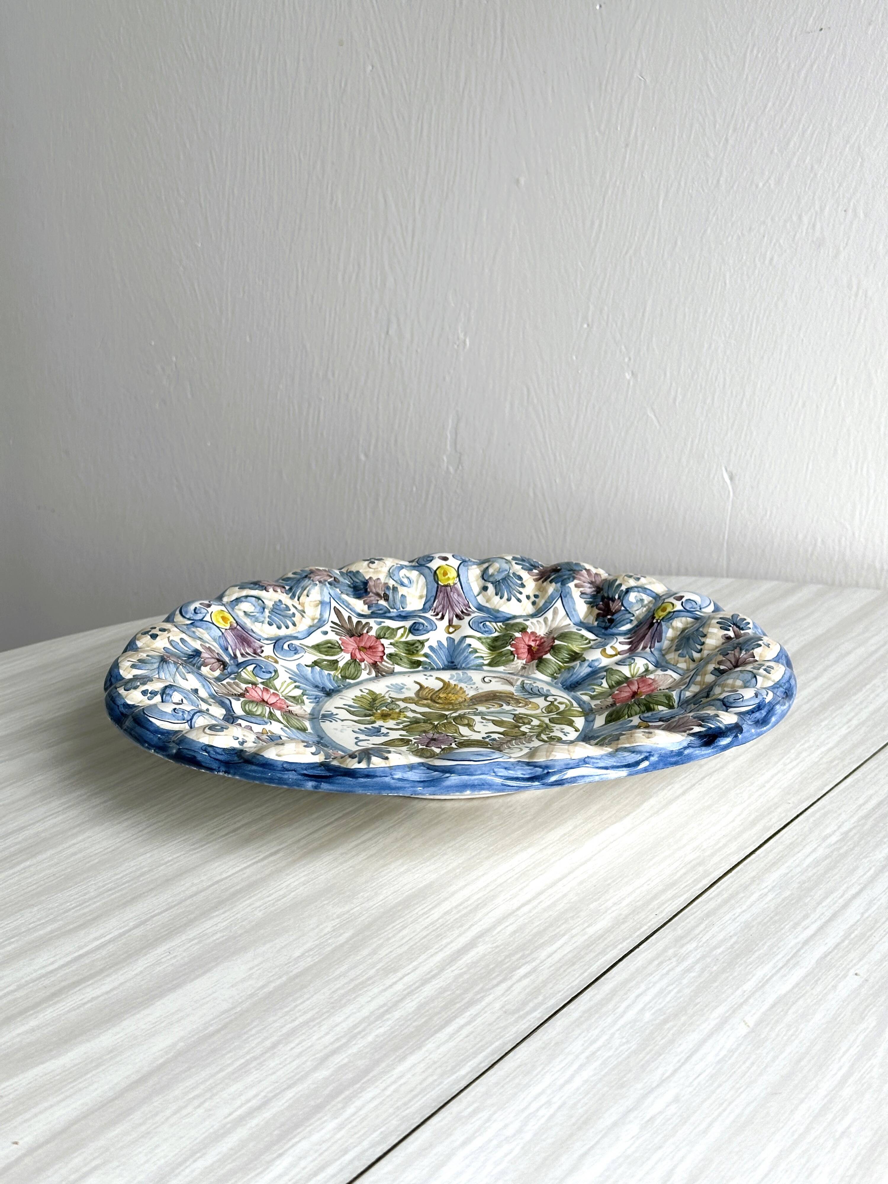 Large decorative dish hand painted with floral and bird motifs