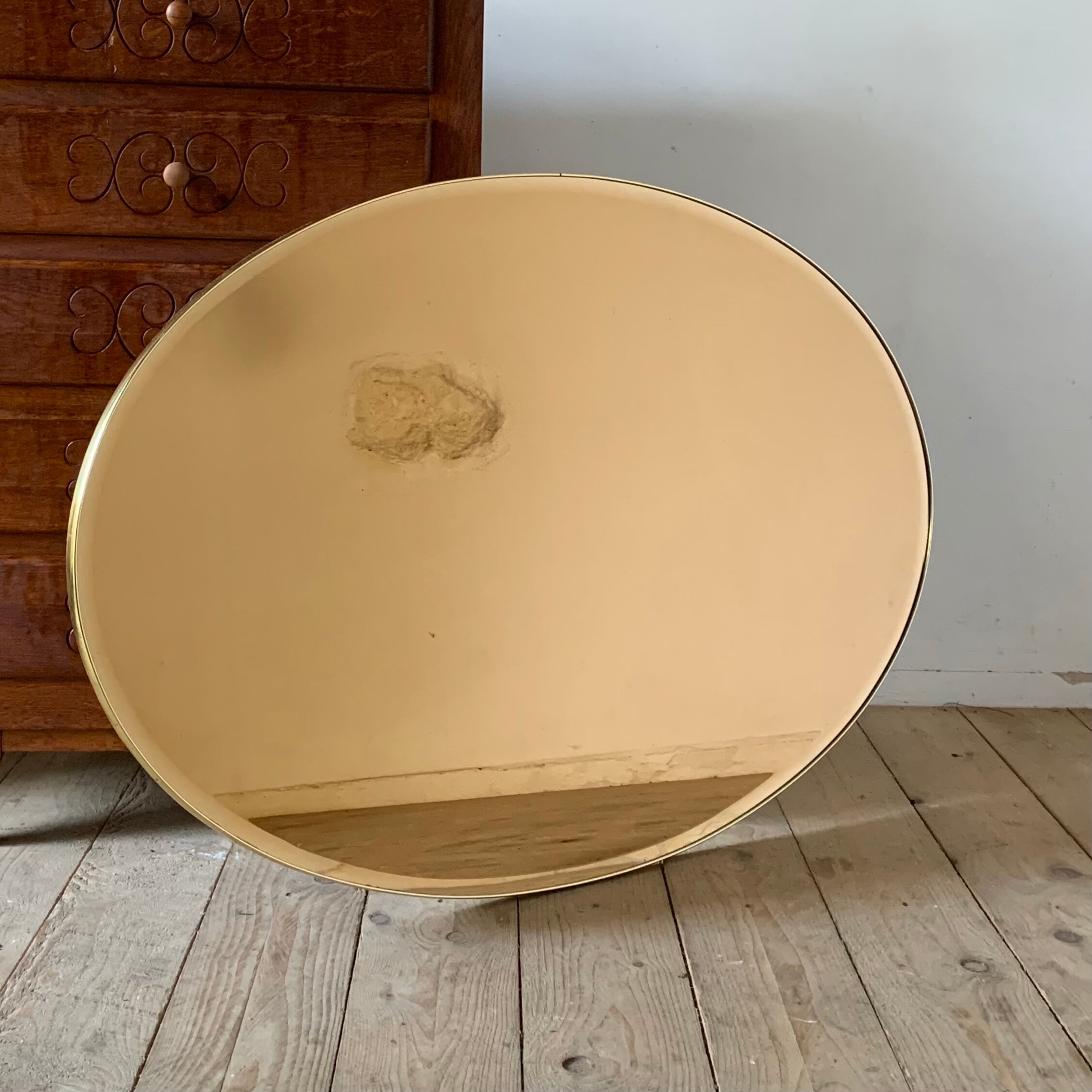 Vintage smoked oval wall mirror