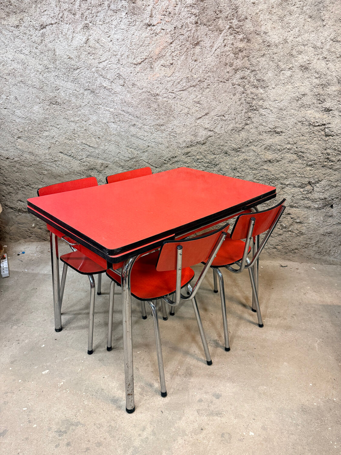 4 red Formica chairs with a 1970s table