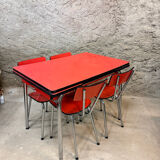 4 red Formica chairs with a 1970s table