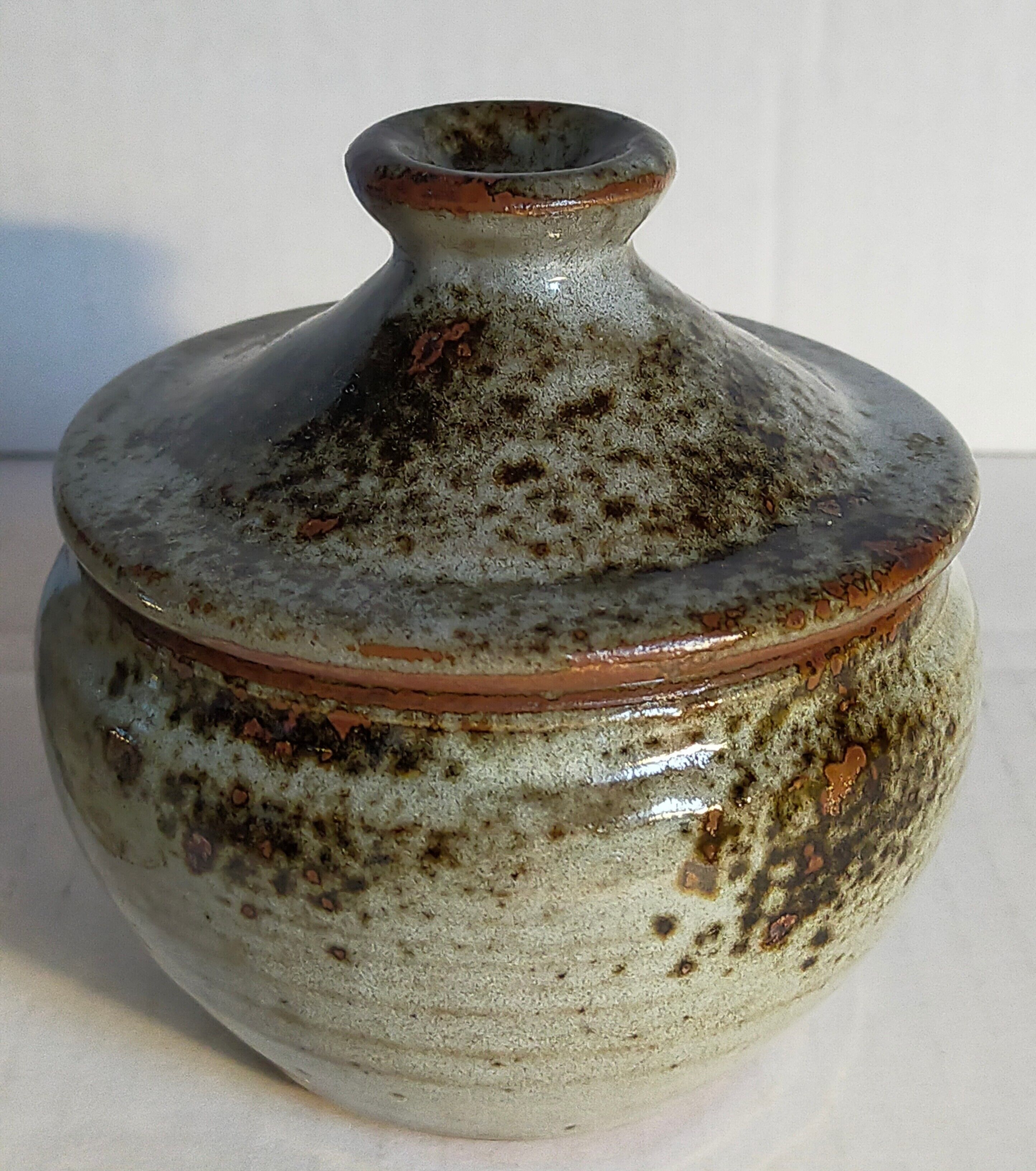 Duo of potter's pots covered in vintage glazed stoneware