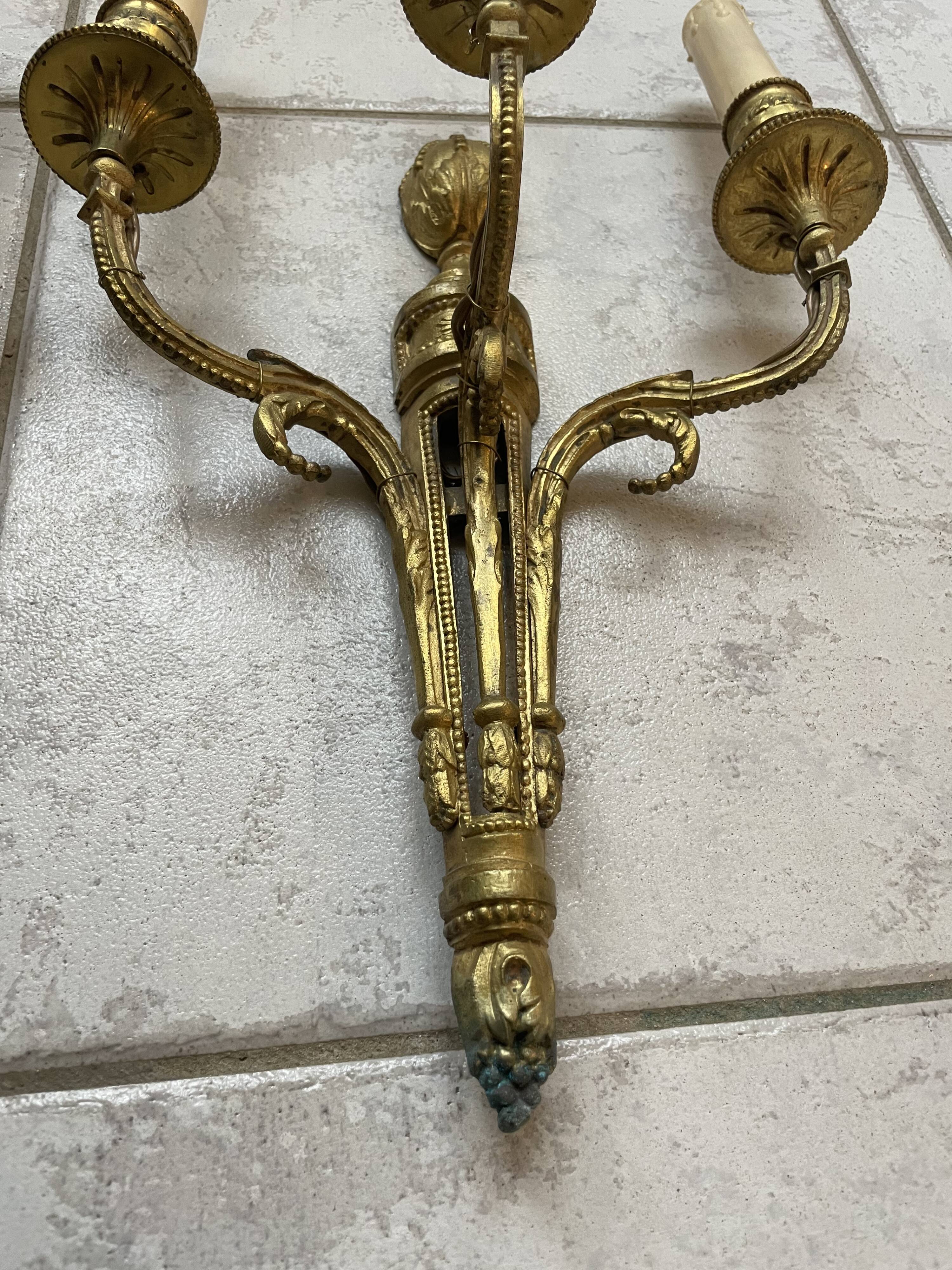 Pairs of Louis XVI bronze wall lamps