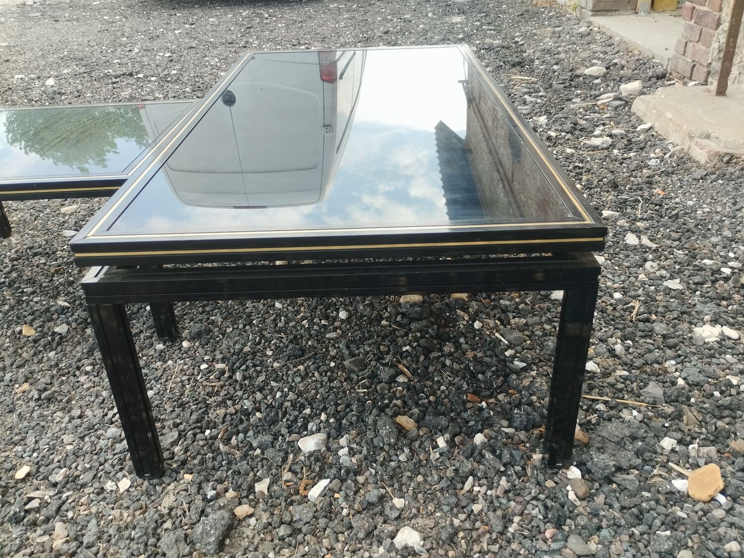 Vintage metal coffee table with glass top.