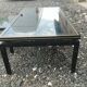 Vintage metal coffee table with glass top.