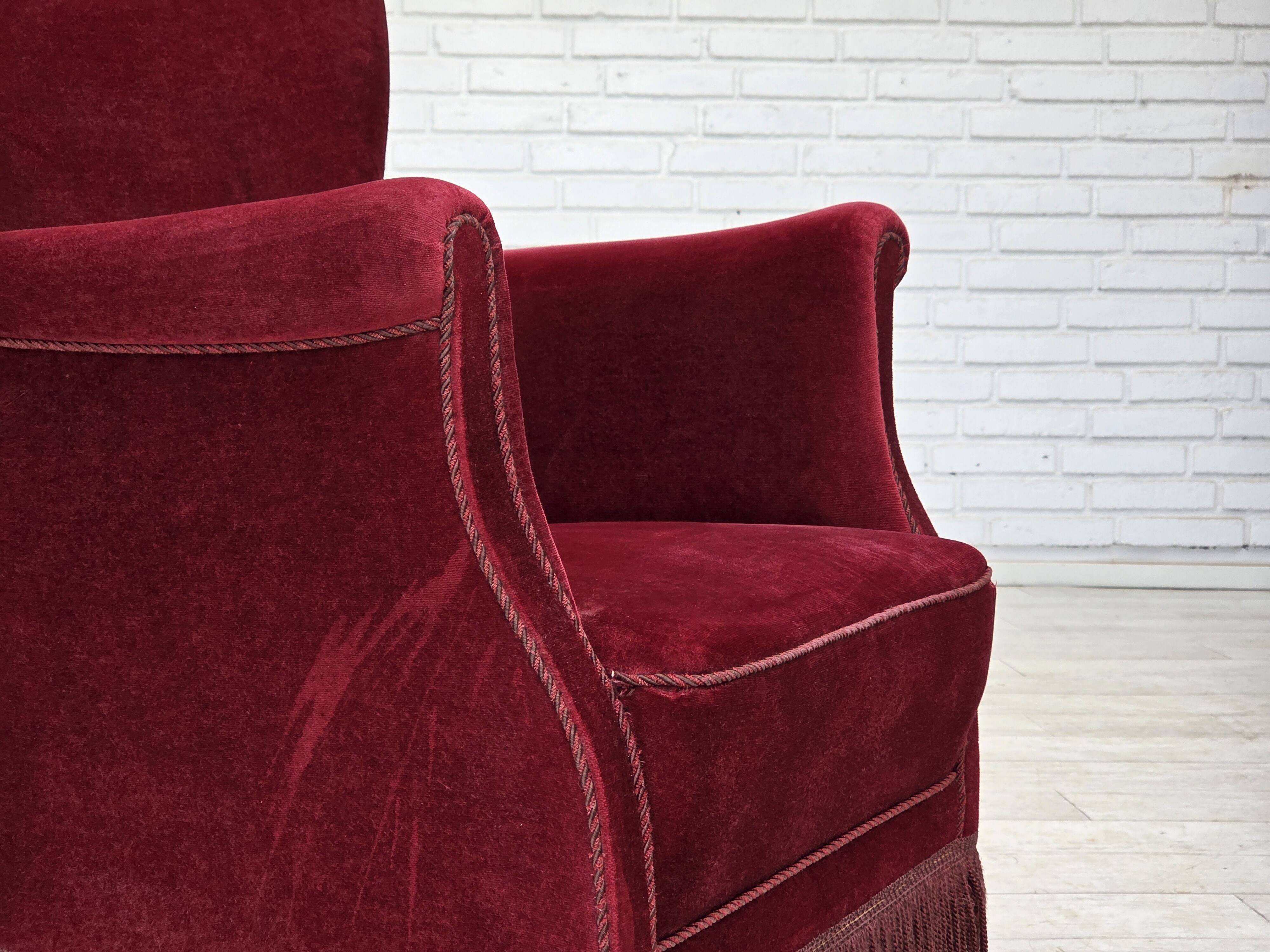 1970s, Danish armchair, cherry-red furniture velour, oak wood legs.