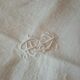 Nappe et ses 12 serviettes damasees décors floral rocaille  brodé monogramme