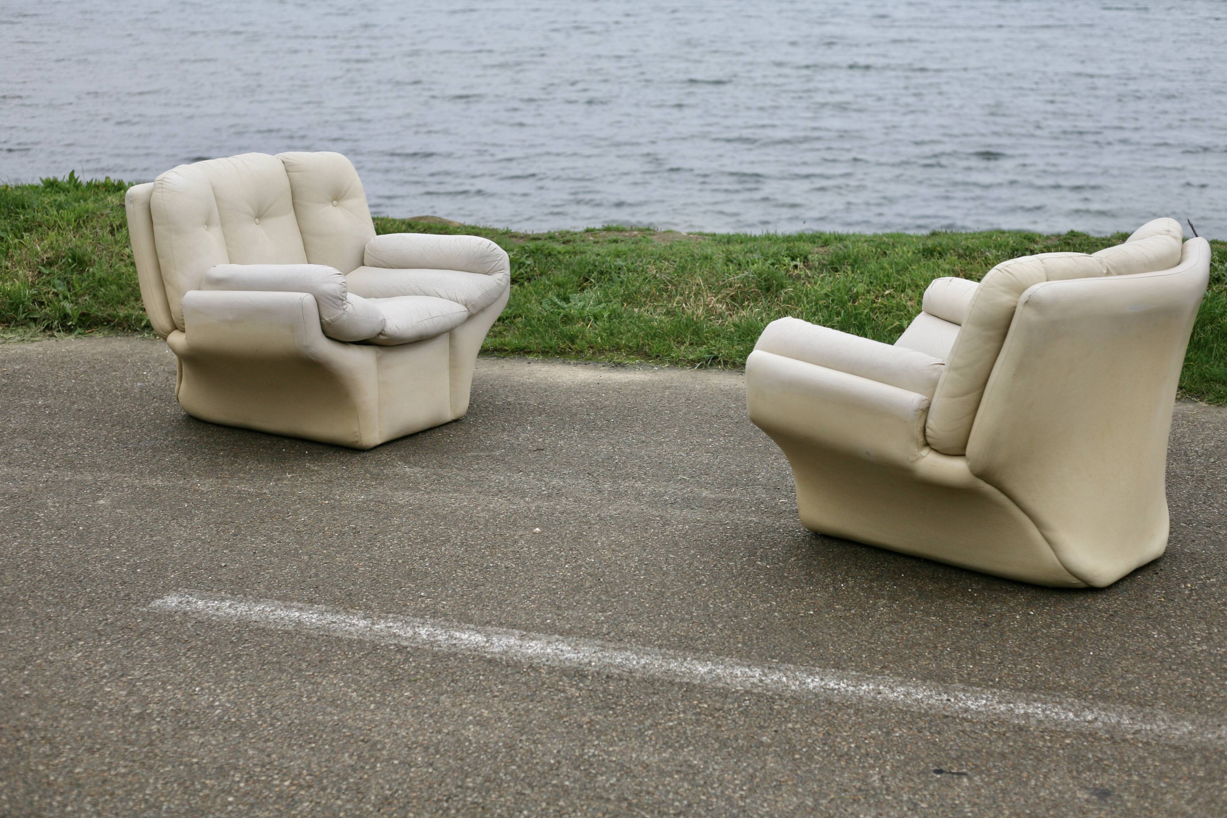 Pair of leather “space age” armchairs. Cream colour". Circa 1970.