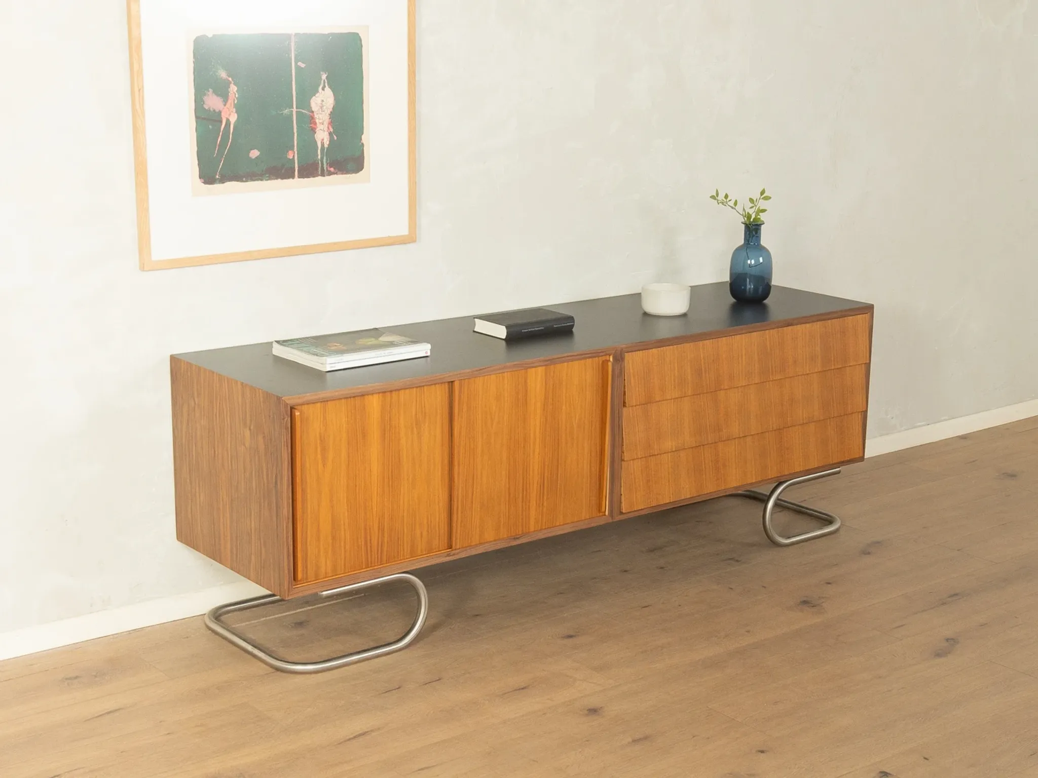 Striking mid-century sideboard with stainless steel base