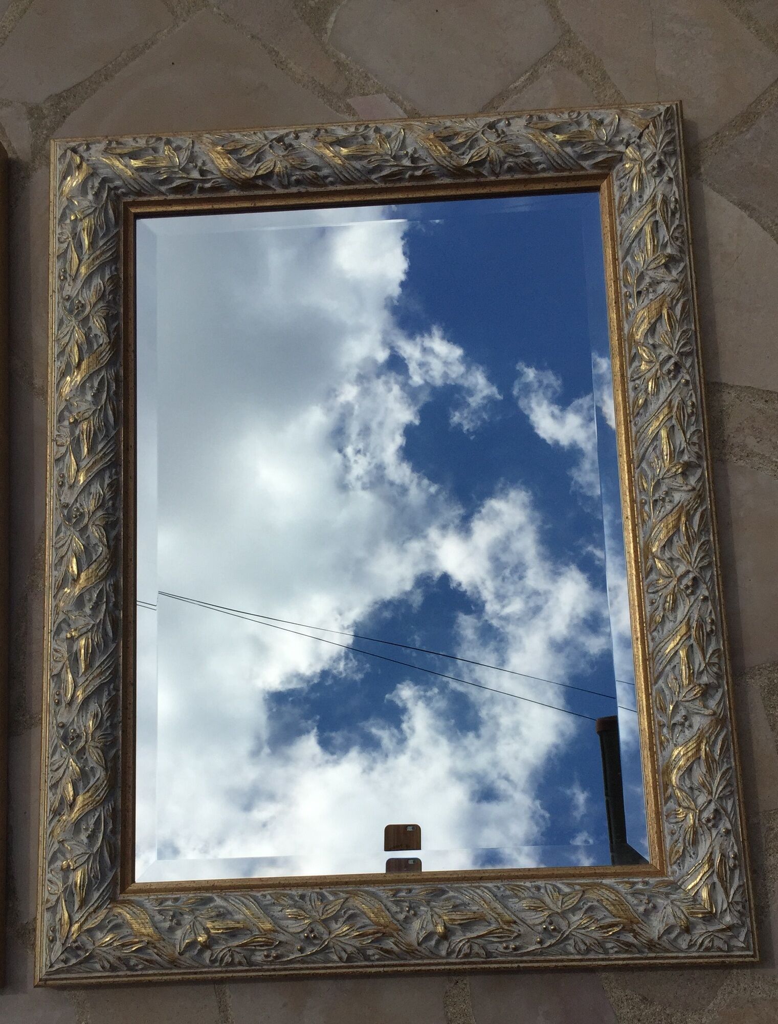 Pair of bevelled mirrors in white and gilded wood 86 x 66 cm