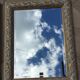 Pair of bevelled mirrors in white and gilded wood 86 x 66 cm