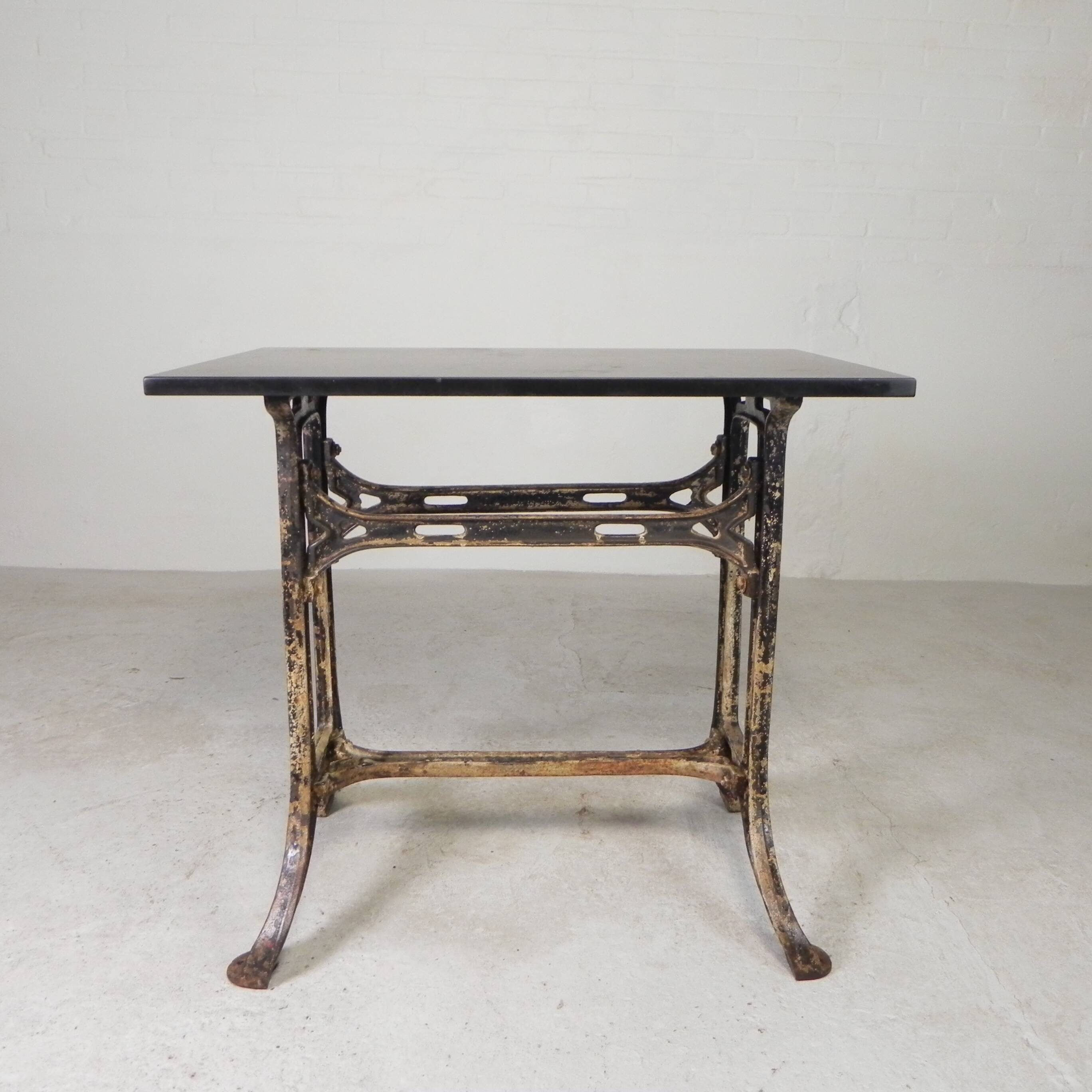 Industrial table, garden table with hard stone slab on cast iron frame, 1930s