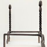 Pair of sculptural cast iron chenets with twisted heads