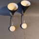 Pair of bedroom sconces in gilded brass and black aluminum 1960.