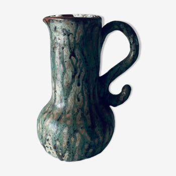 Old pitcher in glazed terracotta