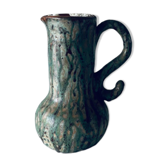 Old pitcher in glazed terracotta