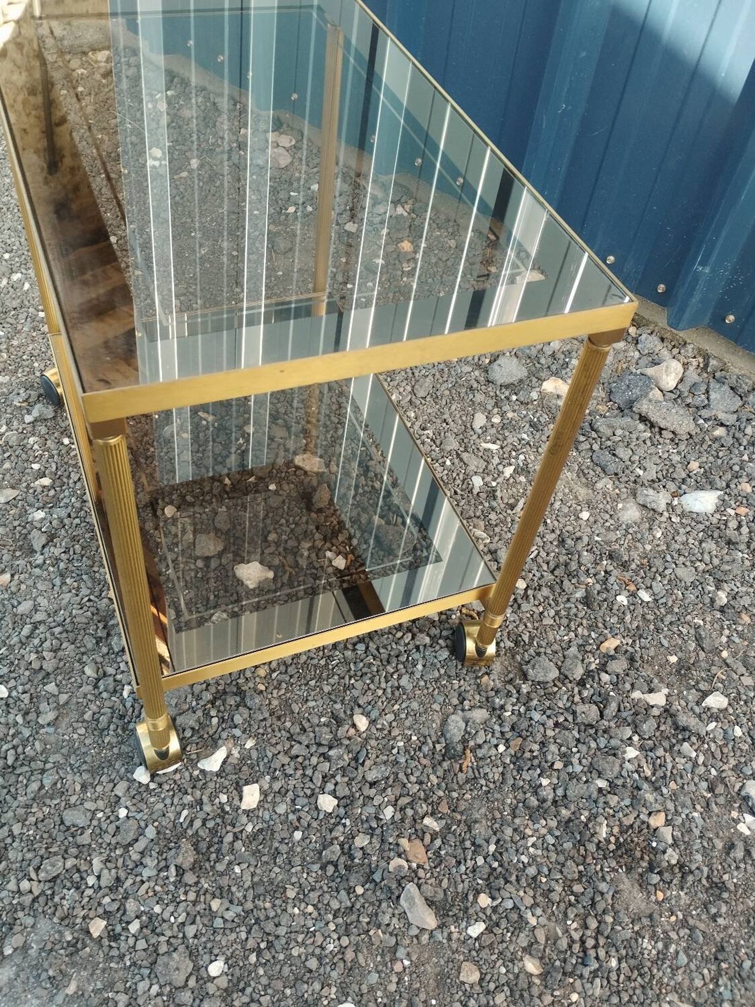 Vintage golden metal rolling dessert trolley