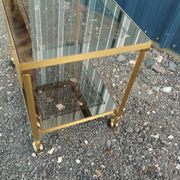 Vintage golden metal rolling dessert trolley