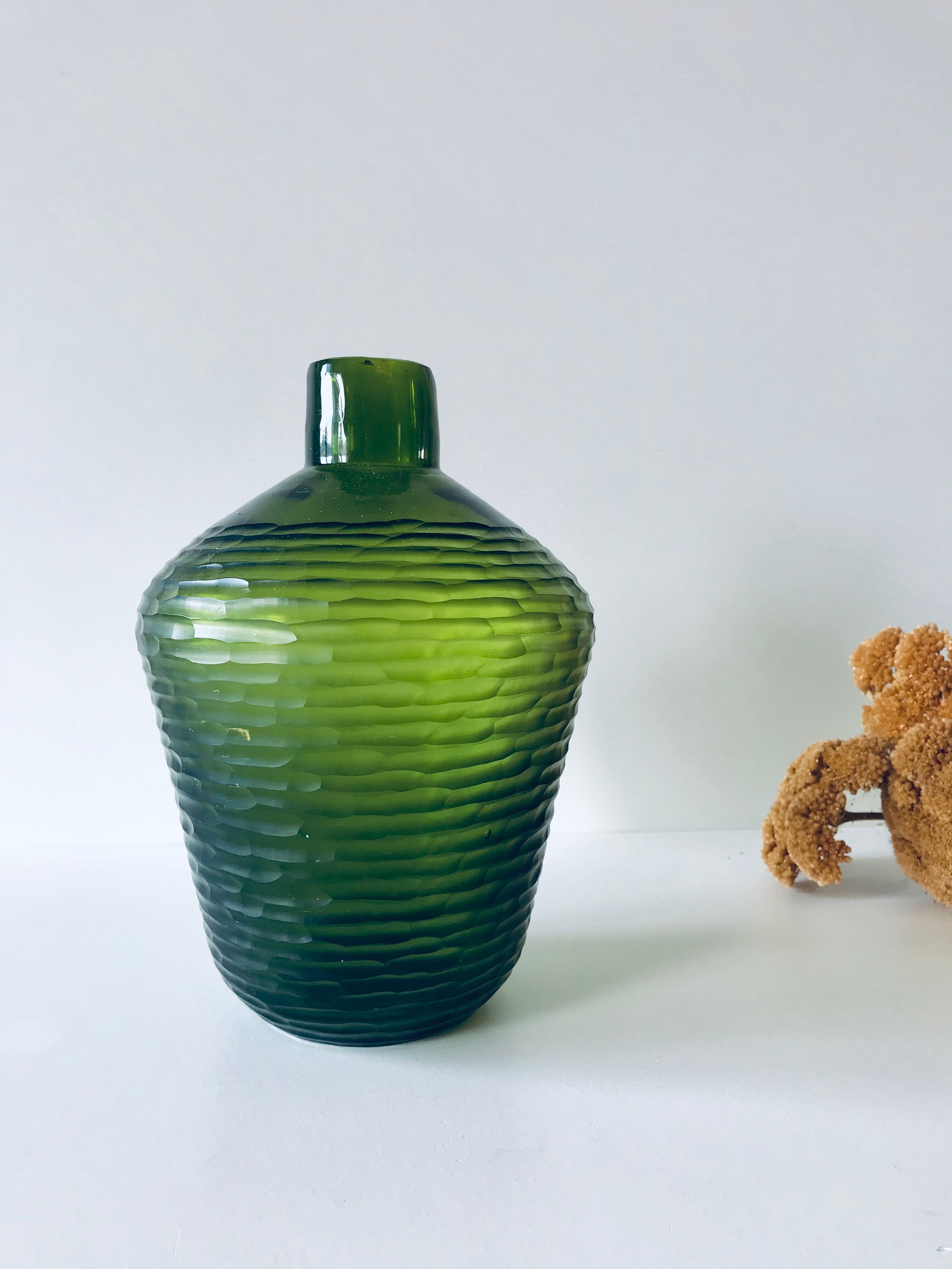 Green carved glass vase