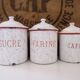 Series of 6 spice pots in white and red enamel for cooking
