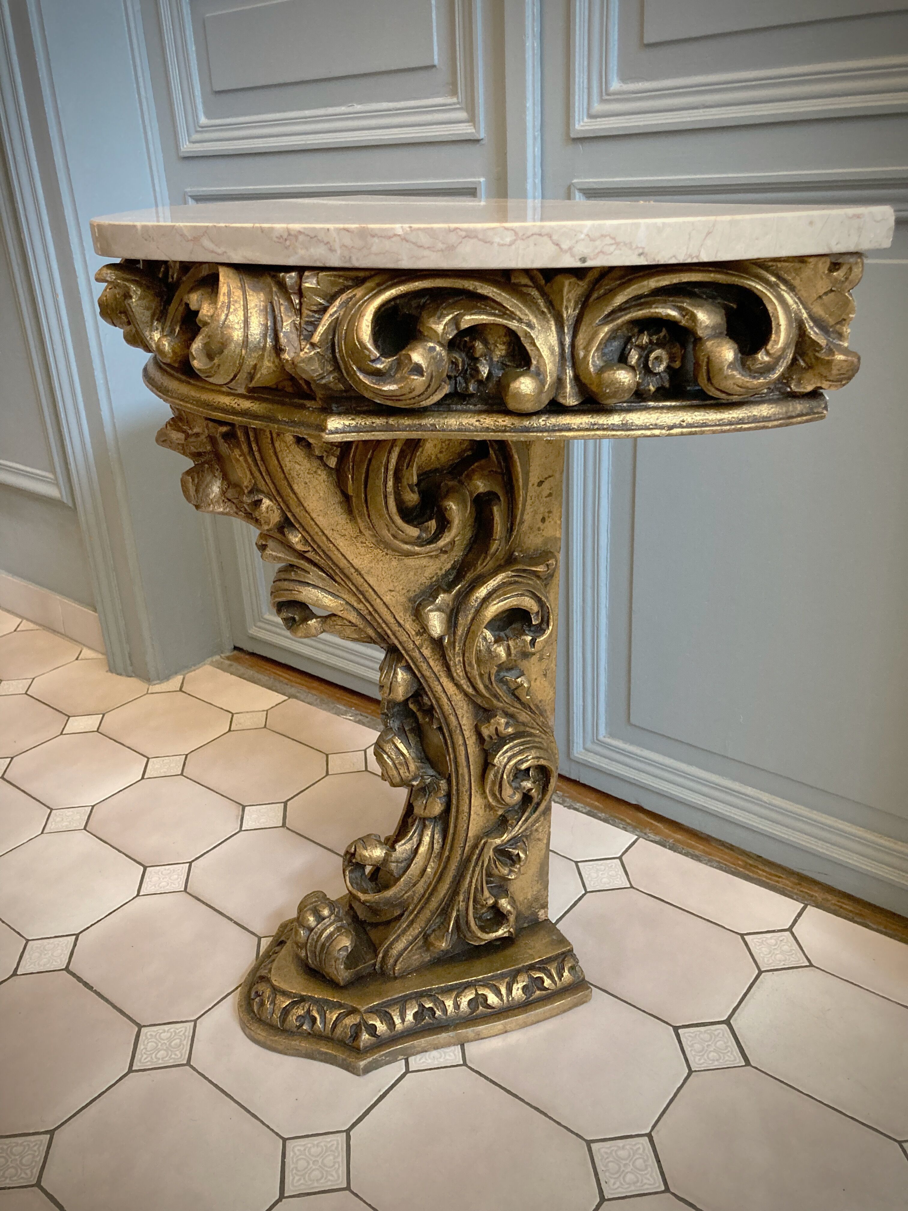Carved wooden and marble console