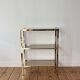 Brass and smoked glass library shelves