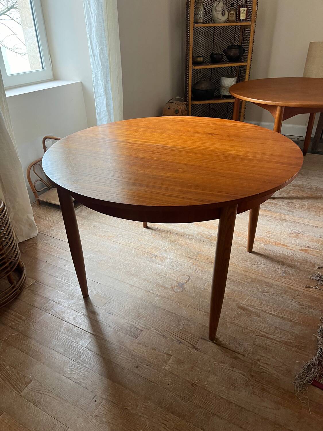 Scandinavian round teak table with butterfly extensions from the 60s