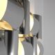 Contemporary wall light in stainless steel and metal.