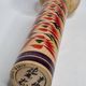 Japanese Kokeshi doll dated 1986, signed and numbered, hand-painted multi-colored floral decoration,