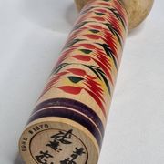 Japanese Kokeshi doll dated 1986, signed and numbered, hand-painted multi-colored floral decoration,