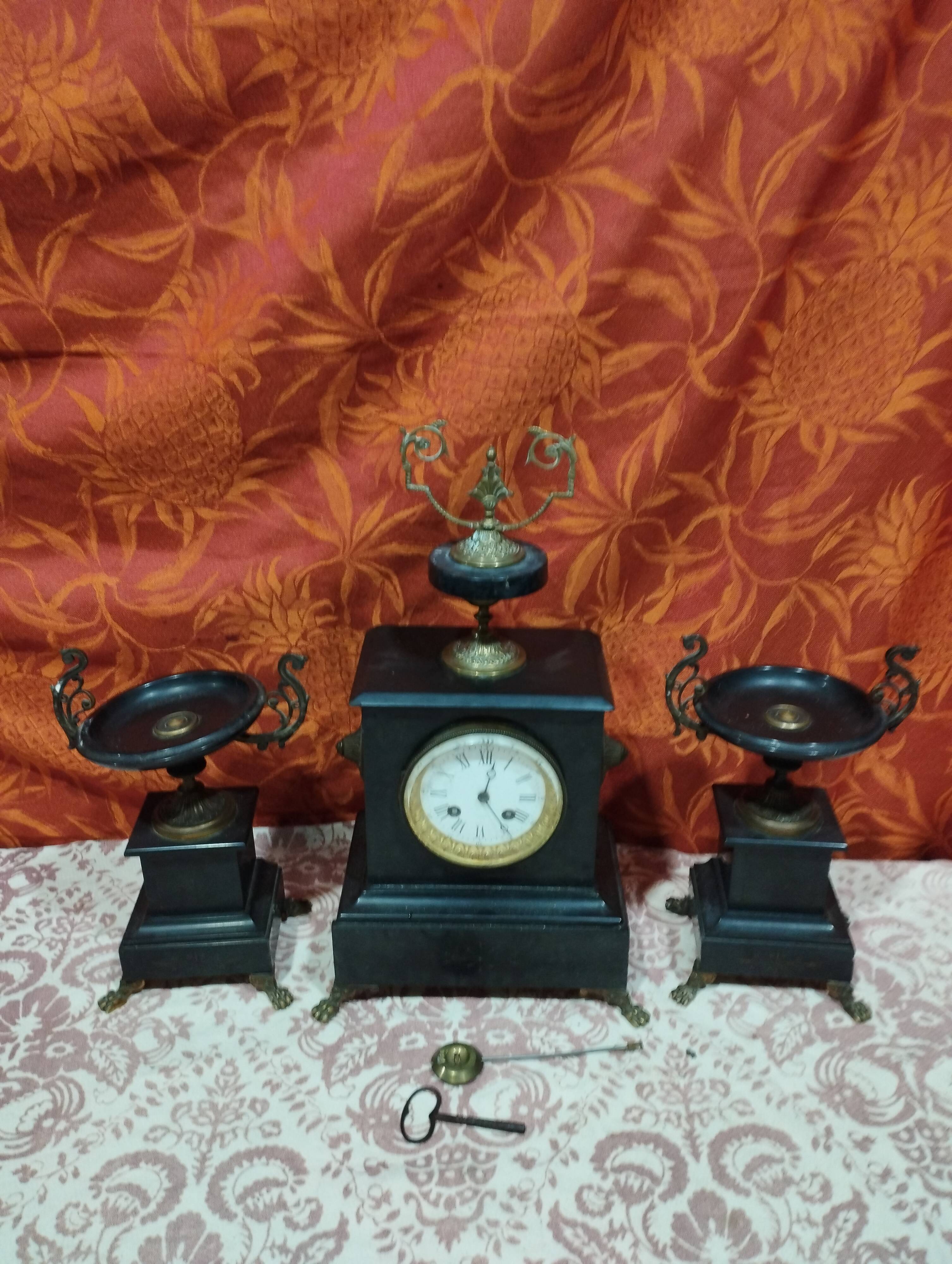 old Napoleon III marble fireplace surround with cups and pendulum