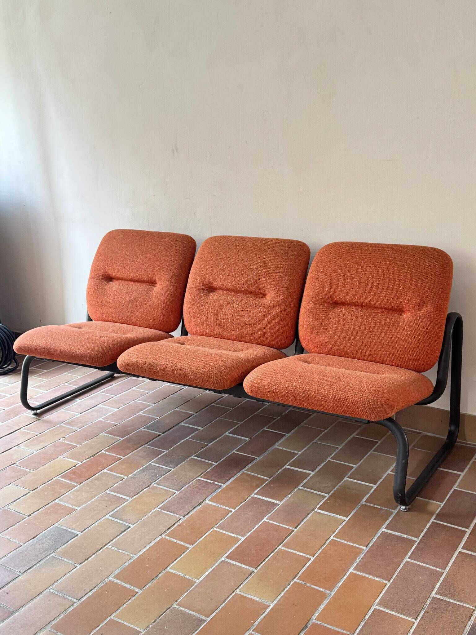 Strafor 3-seater bench, orange wool and sled base, 1970s.