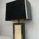 Large lamp in black lacquered wood, gilding and mother-of-pearl. French work. Circa 1970