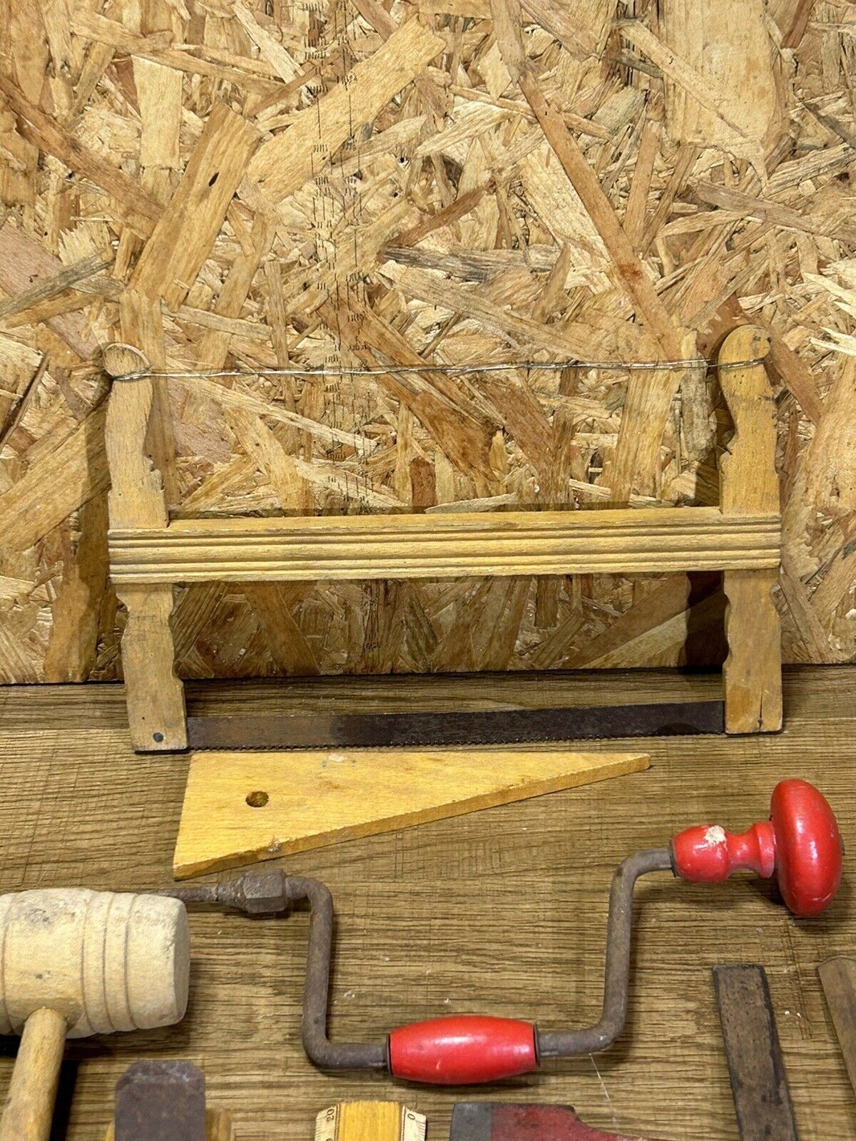 lot of antique toys, carpentry tools, wood, saw, plane, hammer,...