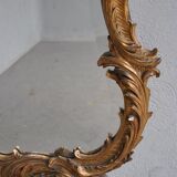 Miroir en stuc doré rocaille époque XIXème 110cm