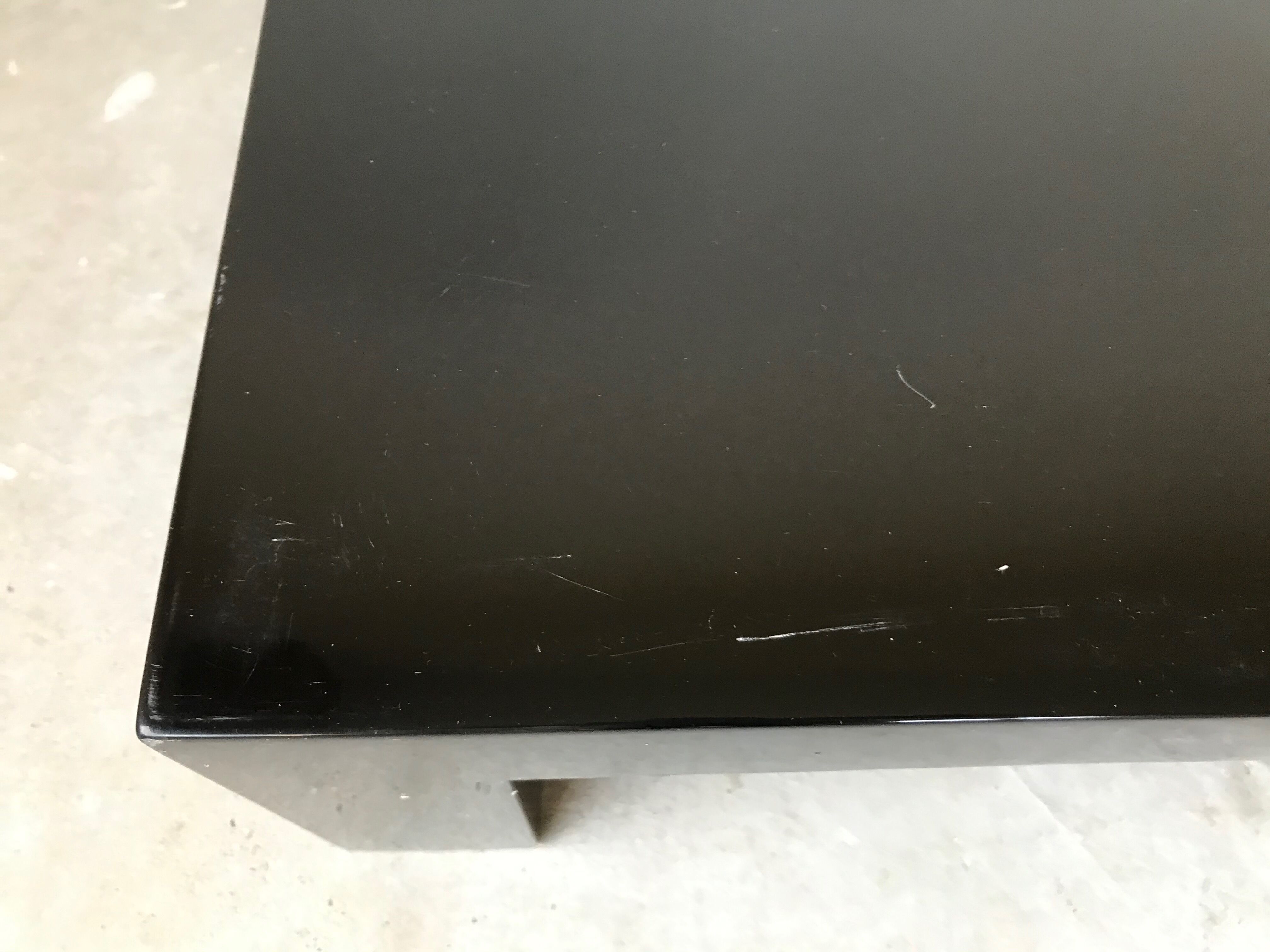 Pair of black laqué wood coffee tables, circa 1970.