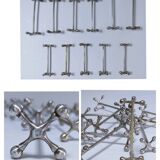 Eleven 70s design metal "crosshair" knife holders
