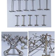 Eleven 70s design metal "crosshair" knife holders