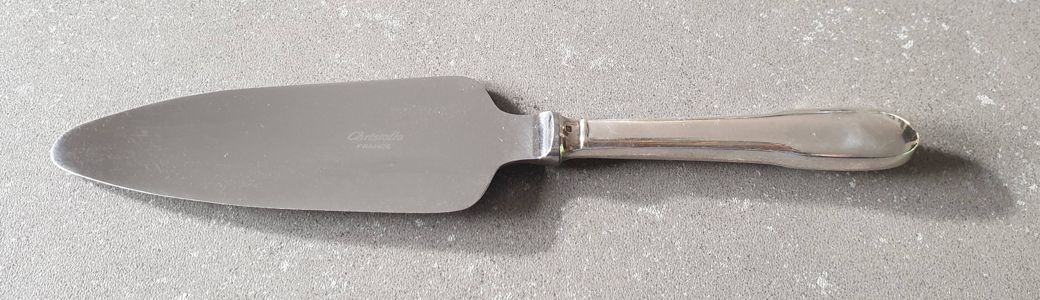 Set of 12 dessert forks and a cake server.