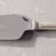 Set of 12 dessert forks and a cake server.