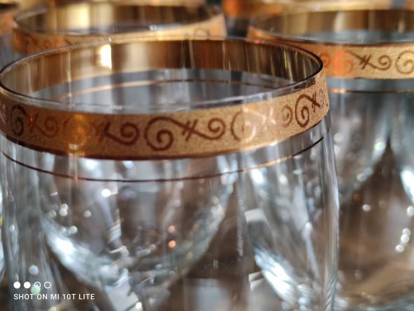 Set of 9 water or red wine glasses in crystal curled and gilded edging