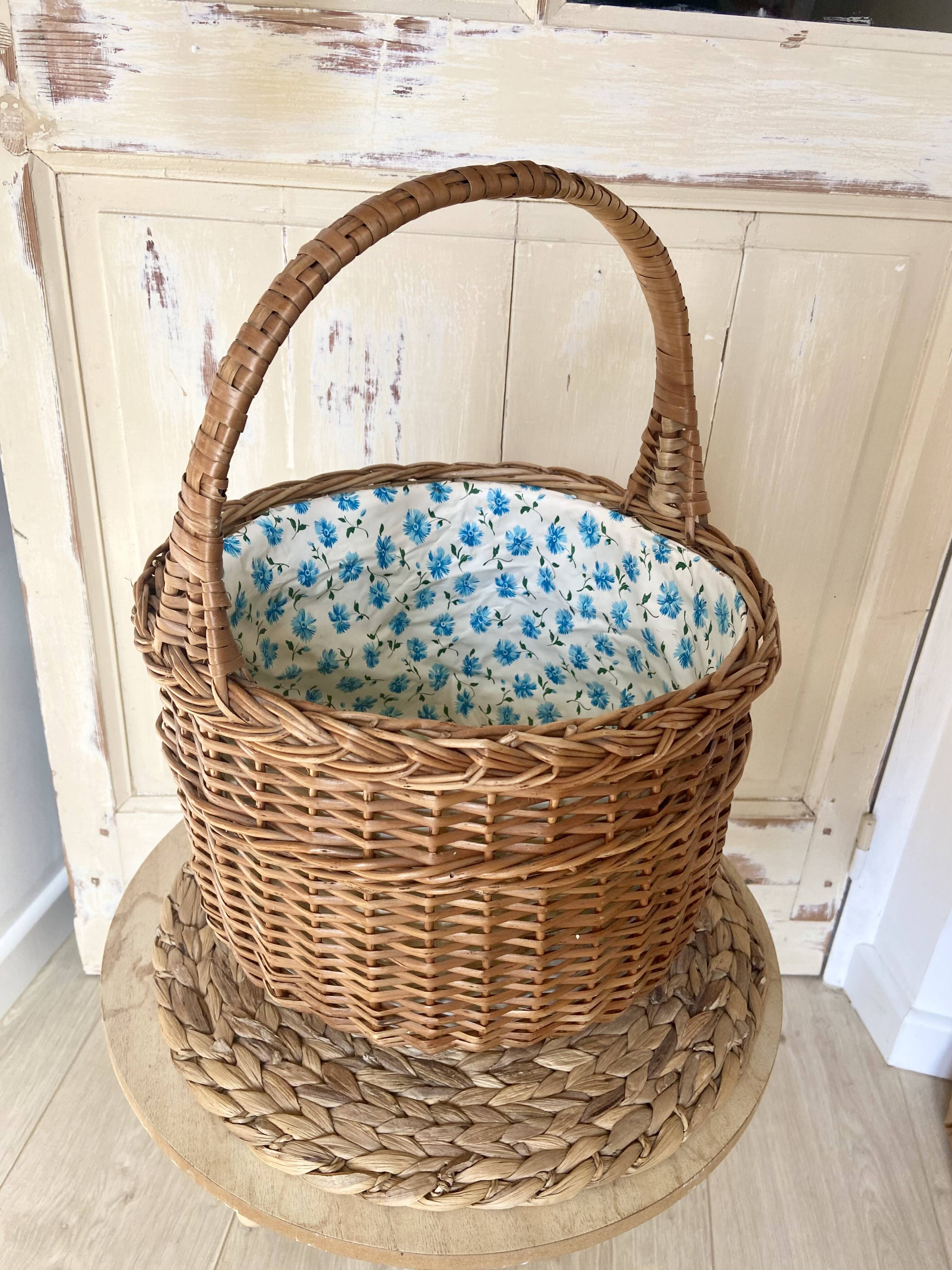 Wicker basket with waxed canvas blue flowers
