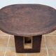 African monoxyle side table in carved wood with a curved top, 48x36 cm.