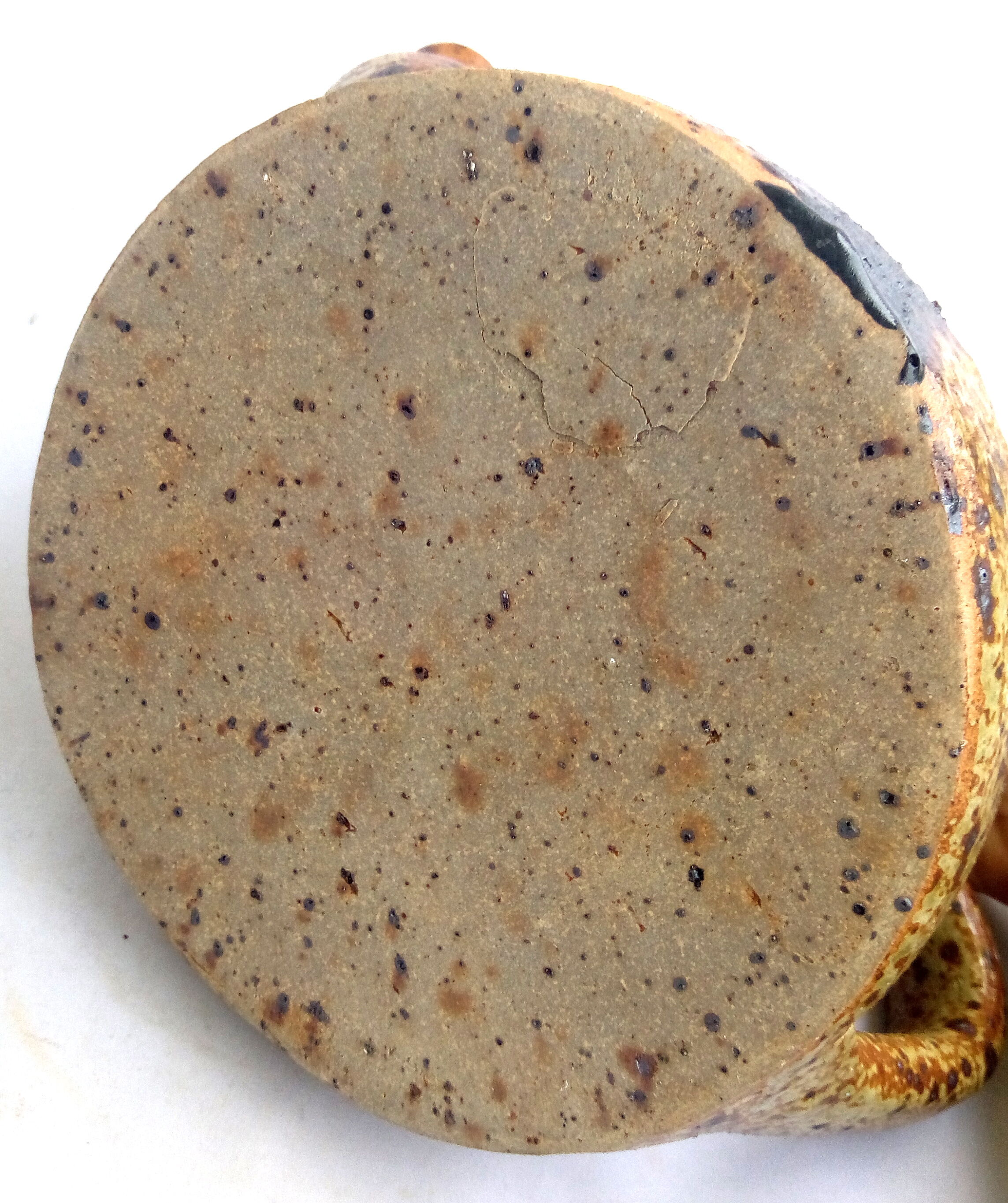 Rustic teapot in pyrity sandstone