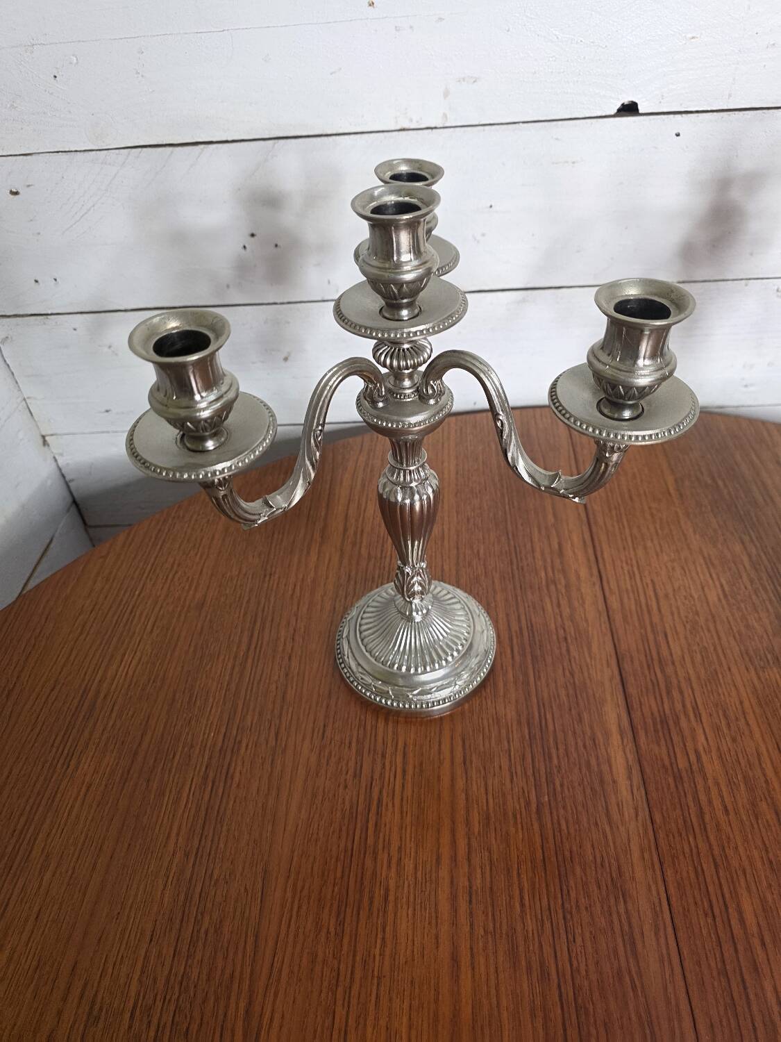 Pair of Louis XVI style candlesticks in silver-plated bronze