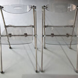 Pair of modern folding chairs in plexiglass